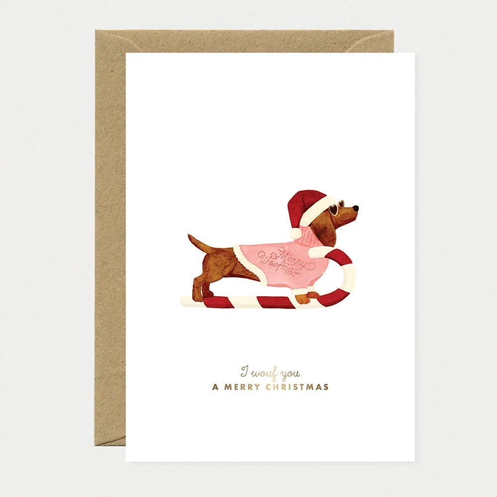 Carte de vœux Merry Woofmas, teckel en traîneau, dorure à chaud - All the ways to say